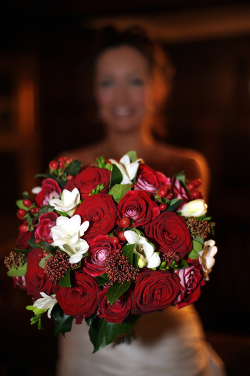 bride with her wedding flowers by professional photographer David J Colbran